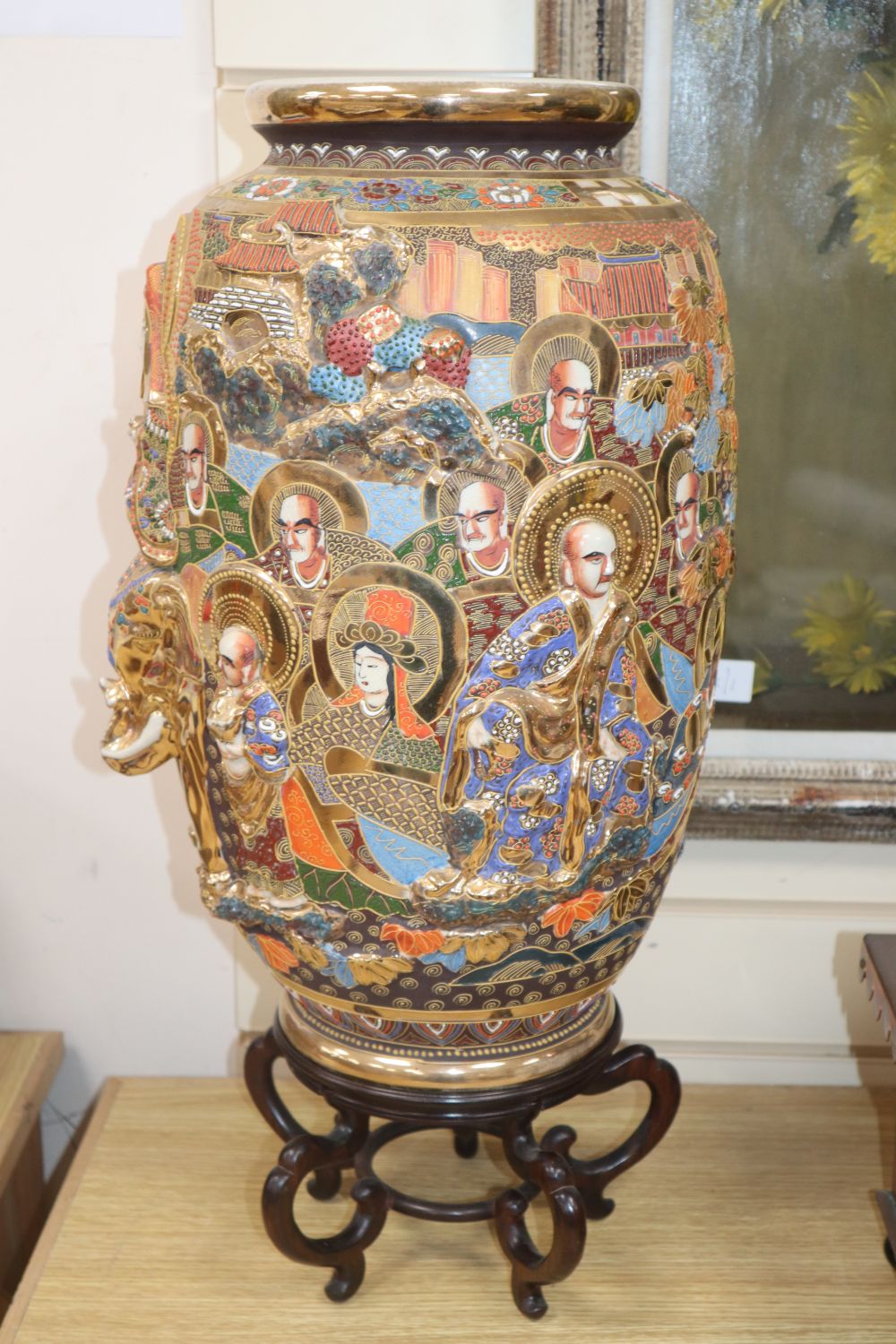 An early 20th century Japanese Satsuma ovoid pottery vase, 46cm, on hardwood stand